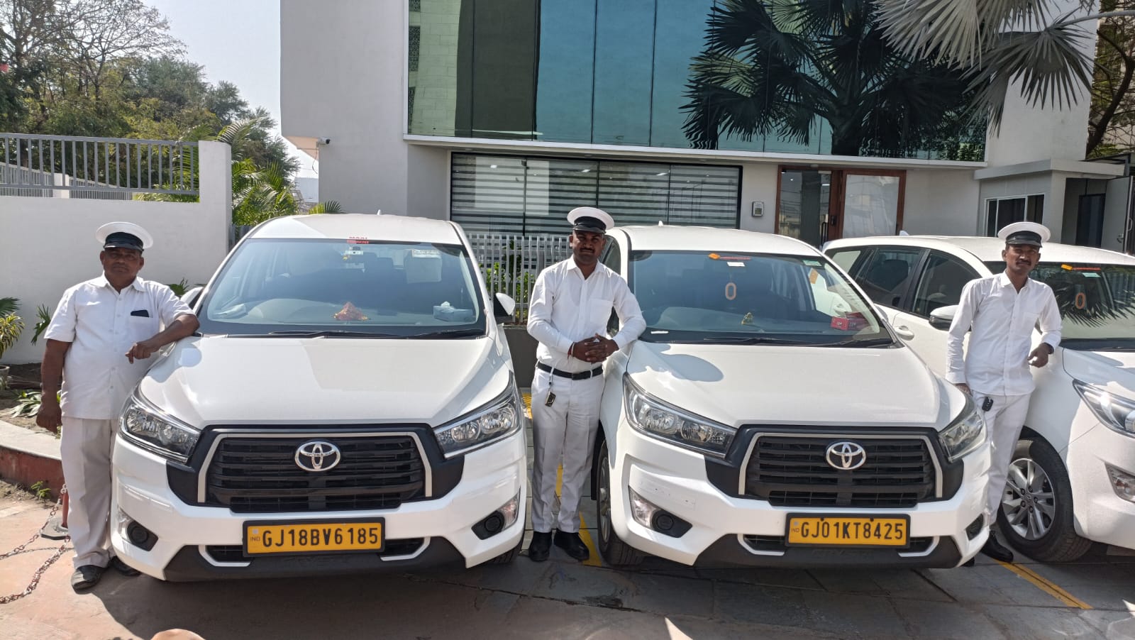 Vibrantcar uniformed chauffeurs with a corporate fleet of Toyota Innova Crysta vehicles