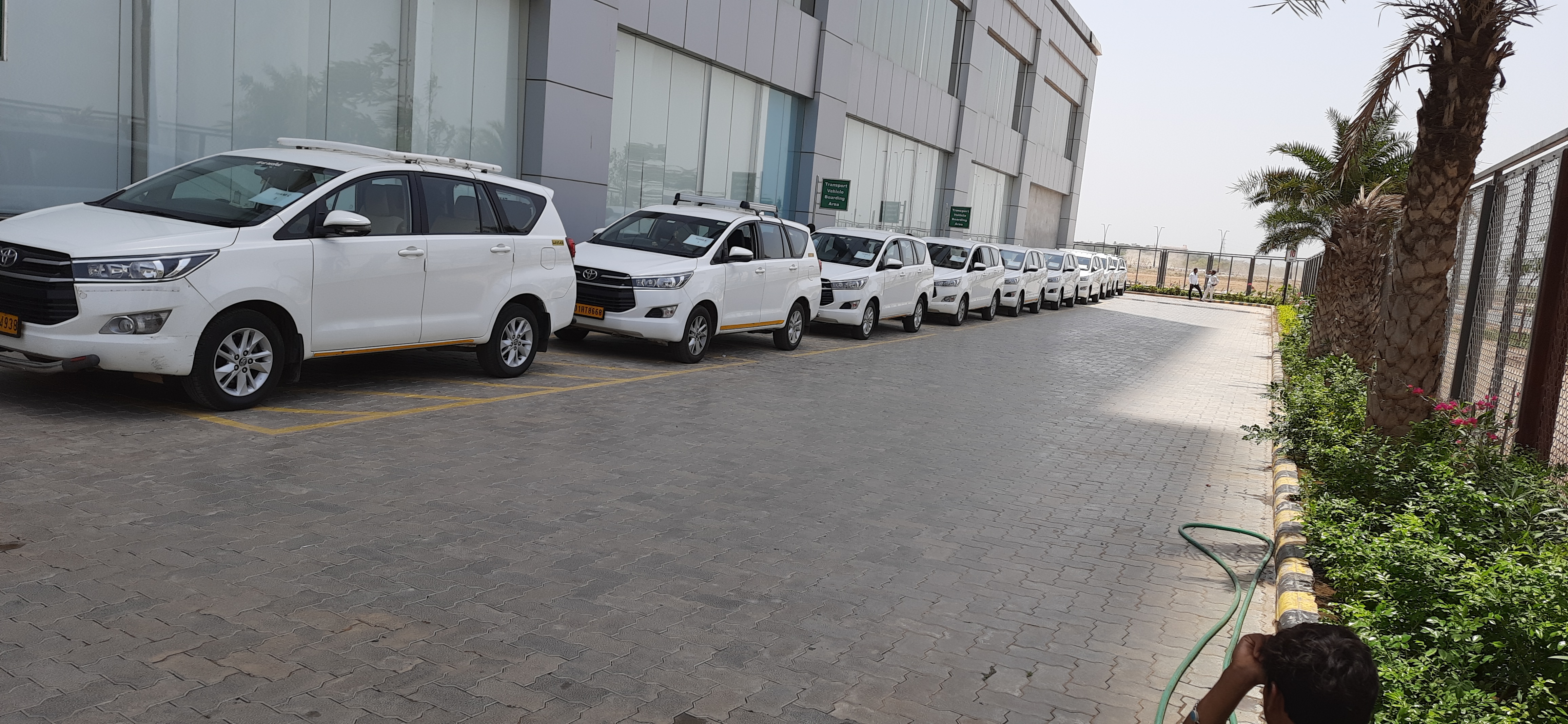 Corporate car rental fleet lined up for a business event, invoiced under GST