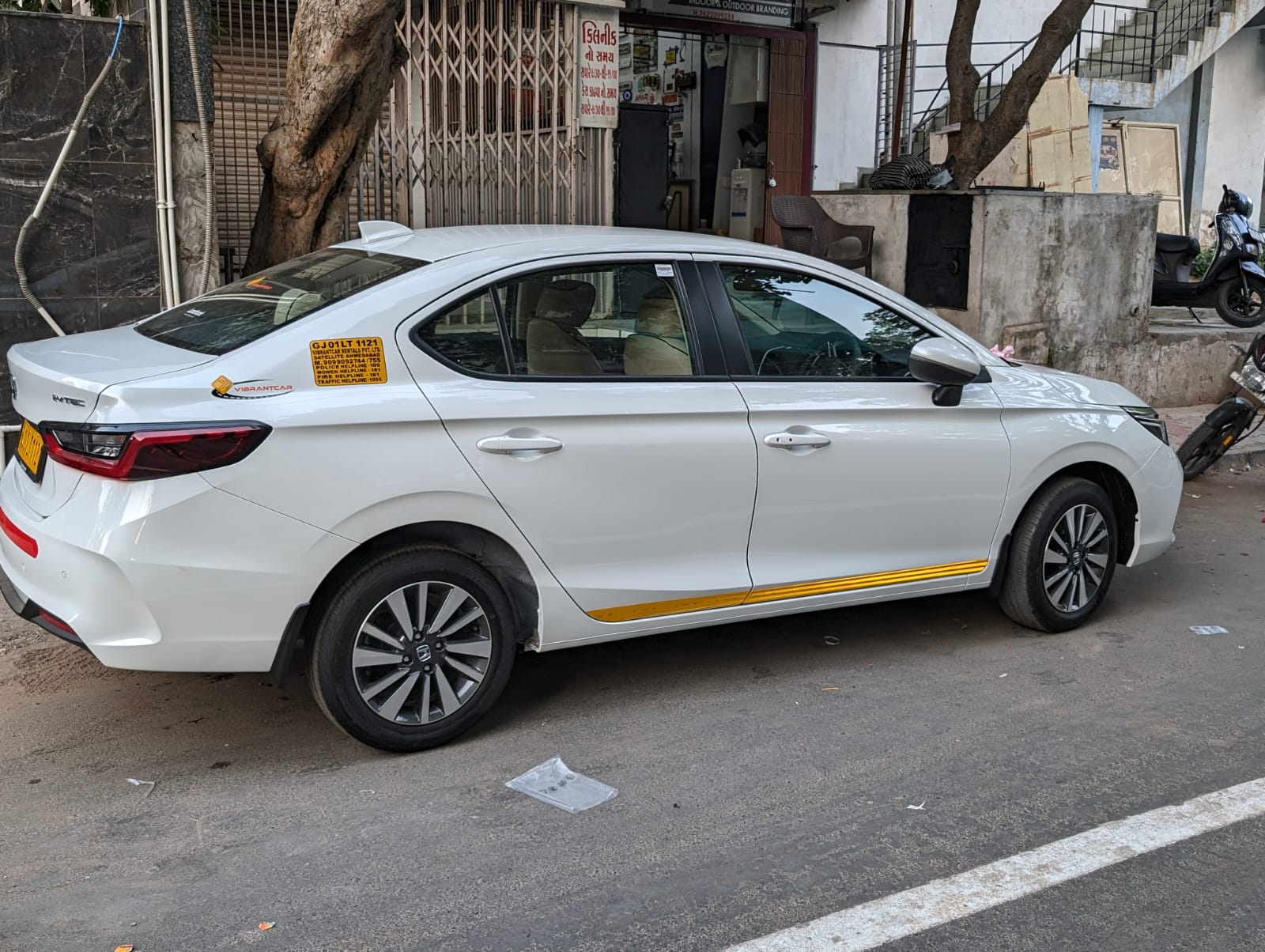 White Honda City sedan on monthly corporate rental with chauffeur